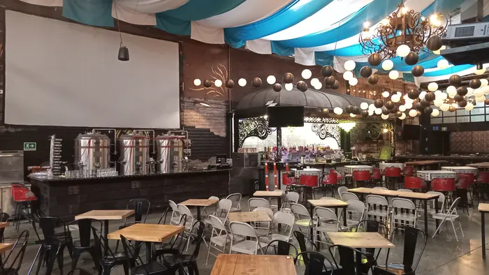 Indoor bar and table seating at Red Macaw